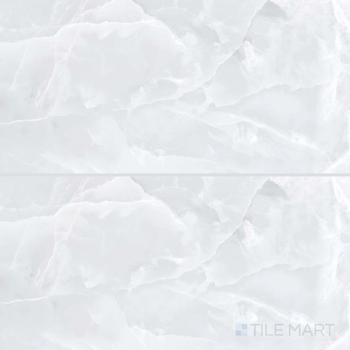 Overview of Soller Onyx Blanco 24x48 polished porcelain tile, highlighting soft veining and reflective white stone aesthetics in a rectangular layout.