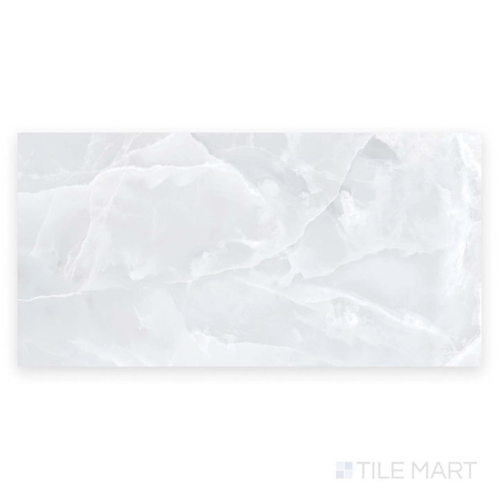 Full tile shot of Soller Onyx Blanco 24x48 polished porcelain tile captured in a top-down angle, emphasizing smooth white surface and subtle marble patterns.