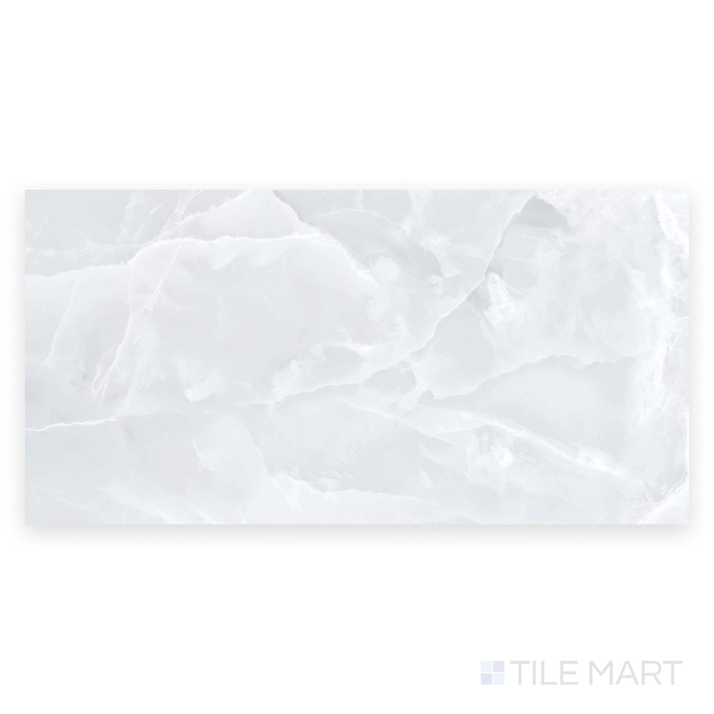 Full tile shot of Soller Onyx Blanco 24x48 polished porcelain tile captured in a top-down angle, emphasizing smooth white surface and subtle marble patterns.