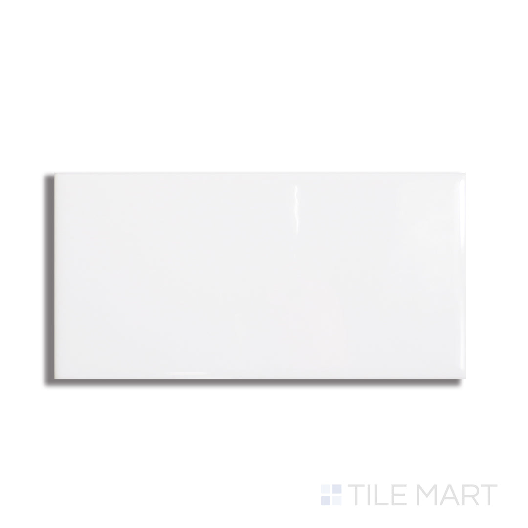 Top-down view of Basics White 3x6 glossy ceramic tile, showing a smooth white surface with a reflective finish and clean edges.
