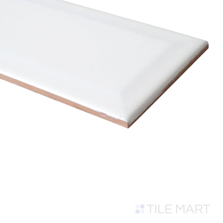 Basics White 3X6 Beveled Glossy tile shines from the edge, showing its raised profile and gleaming finish.