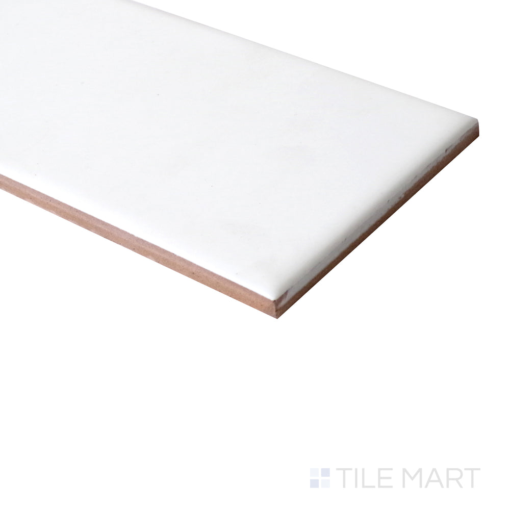 Matte finish of Basics White 3X6 Ceramic tile is seen from a corner, emphasizing soft texture and subtle tone.