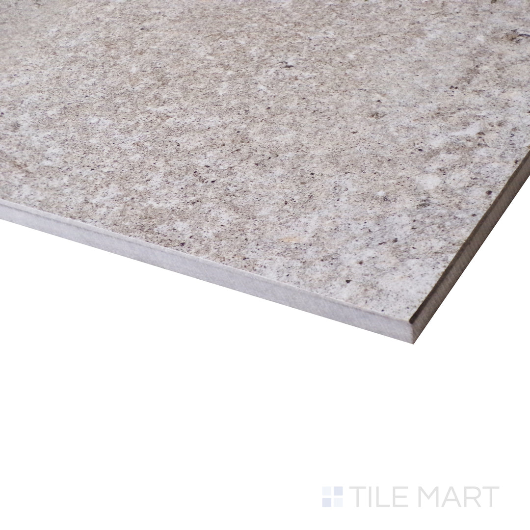 A refined corner view reveals the soft texture and neutral tone of Brooklyn Cemento Greige 24X48 Honed Porcelain.