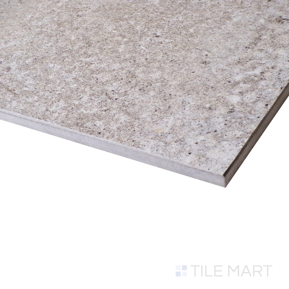 A refined corner view reveals the soft texture and neutral tone of Brooklyn Cemento Greige 24X48 Honed Porcelain.