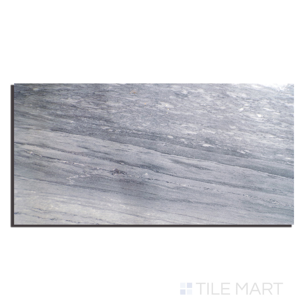 Top-down image of Exotic Stone Nebula Blue 24x48 polished porcelain tile, highlighting vibrant blue movement and high-gloss reflection.