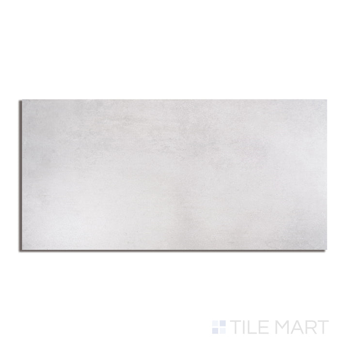 Kadence Gris 12x24 matte porcelain tile in flat view, with soft grey coloring and a subtle matte surface texture.