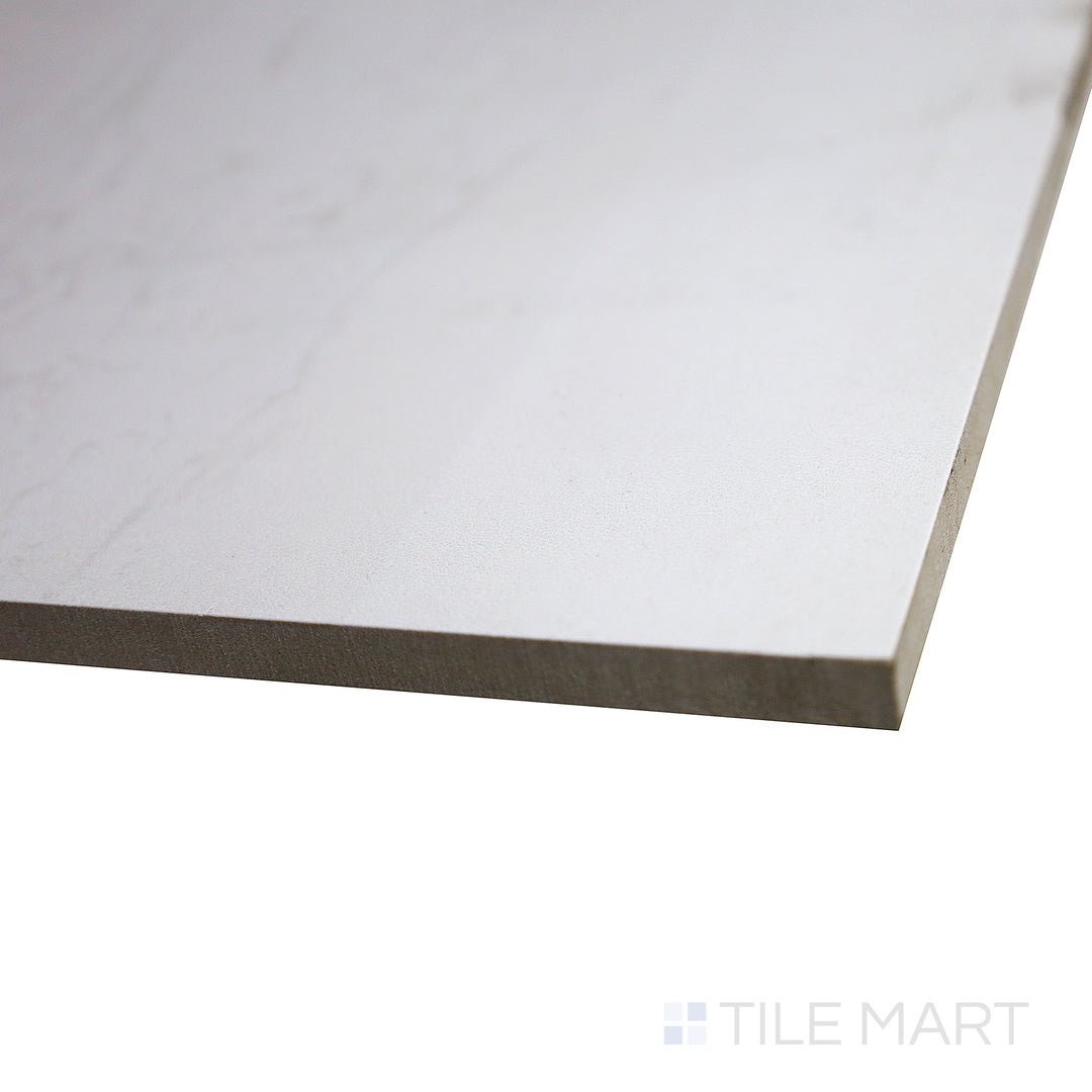 Angled shot of Metal Lux White tile highlights its luminous polish and sleek, modern finish.