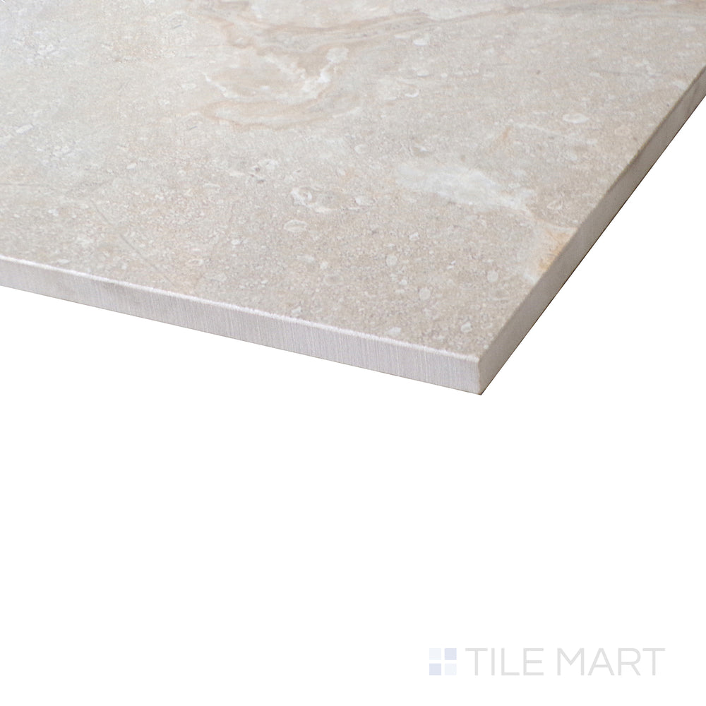 Corner angle reveals the soft tone and polished surface of Atenas Stone tile.