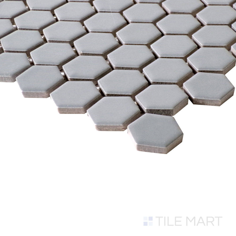 Matte gray hexagon mosaic tiles add texture and style, shown here in a compact corner shot.