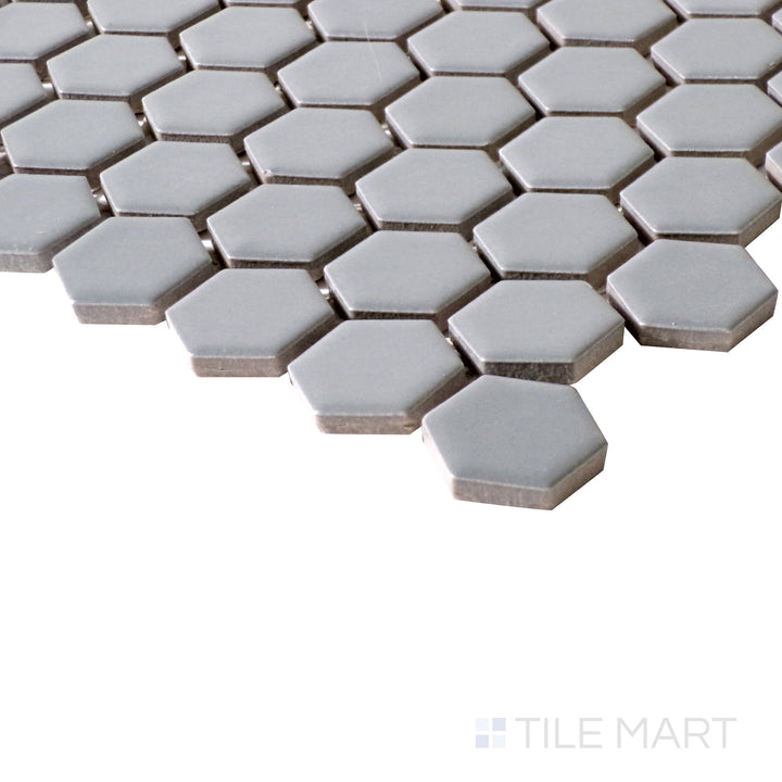 Matte gray hexagon mosaic tiles add texture and style, shown here in a compact corner shot.