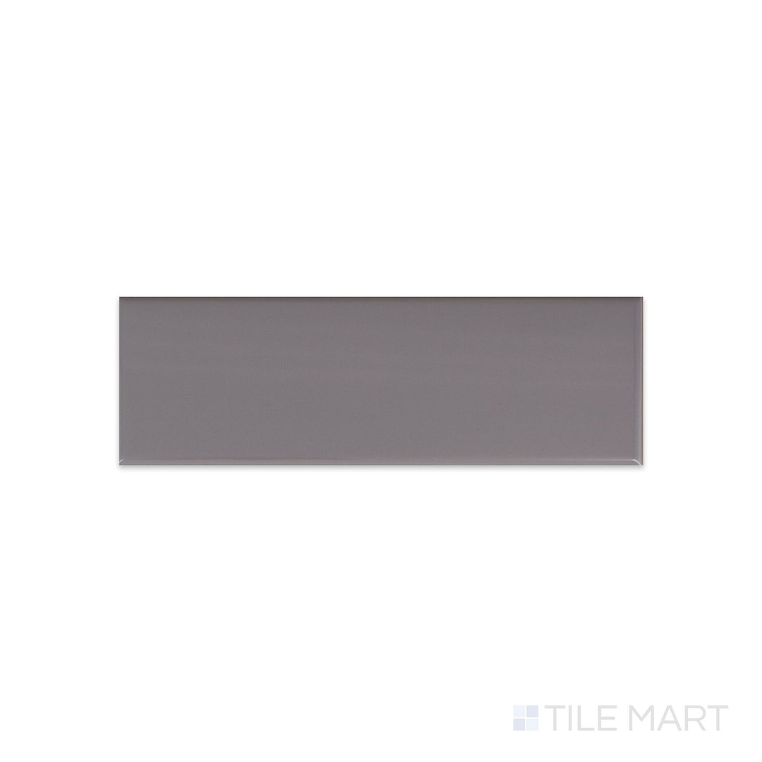 Roxy Hematite 3x9 glossy porcelain tile shown from above, with a sleek metallic grey tone and polished surface for modern appeal.