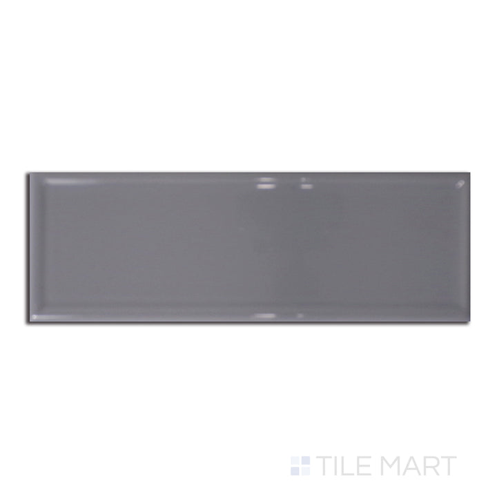 Roxy Hematite 3x9 glossy porcelain tile shown from above, with a sleek metallic grey tone and polished surface for modern appeal.