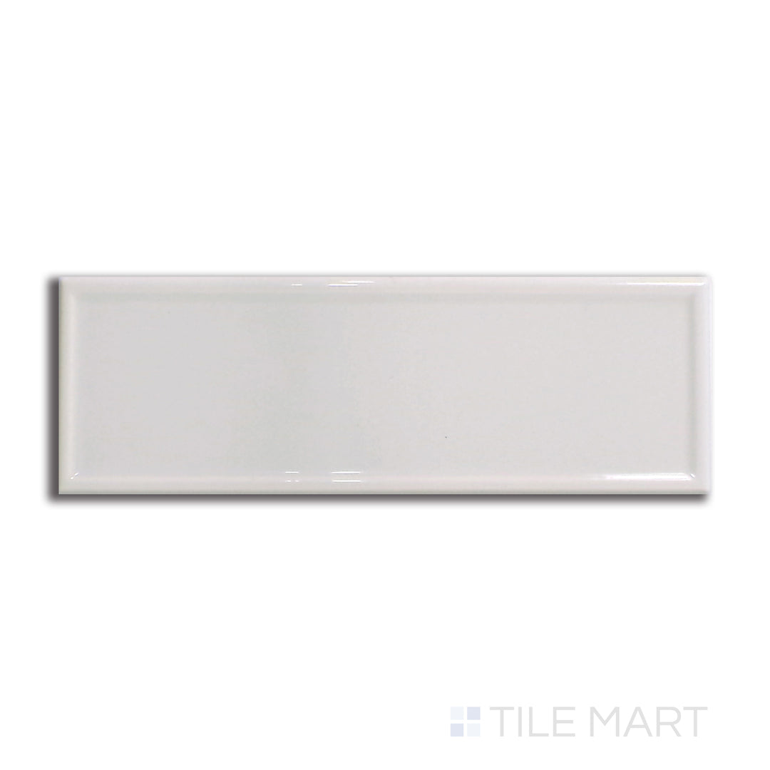 Top-down view of Roxy Moonstone 3x9 glossy porcelain tile, capturing the soft grey hues and lustrous glazed finish.