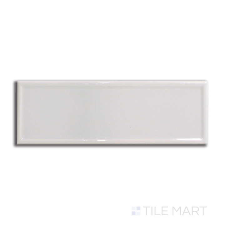 Top-down view of Roxy Moonstone 3x9 glossy porcelain tile, capturing the soft grey hues and lustrous glazed finish.