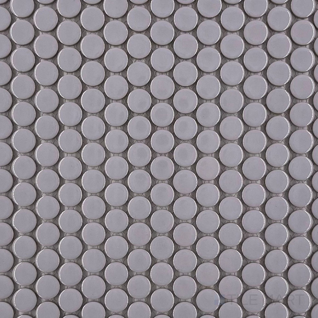 Full overview of Pure Grey Penny Round glossy porcelain mosaic, highlighting its reflective finish and uniform circular layout in soft grey tones.