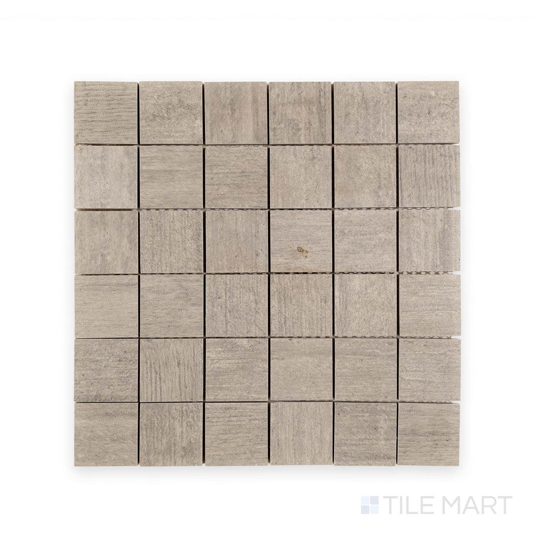 Top-down view of Cemento Dark Grey matte porcelain mosaic tile featuring small square segments in a deep cement gray tone.