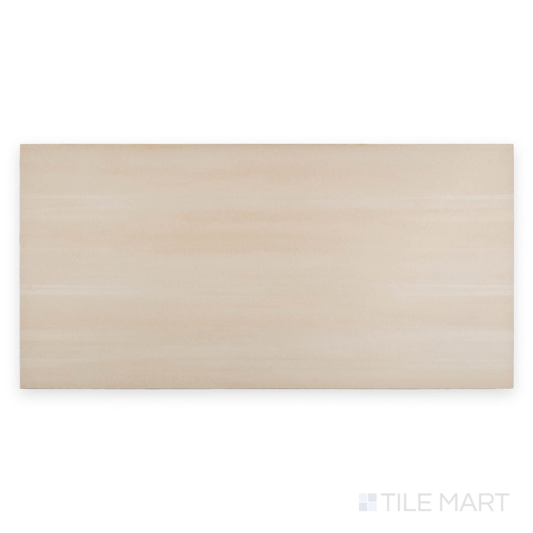 Top-down view of Revenge Beige 12x24 matte porcelain tile with a smooth beige finish and faint stone-like detailing.