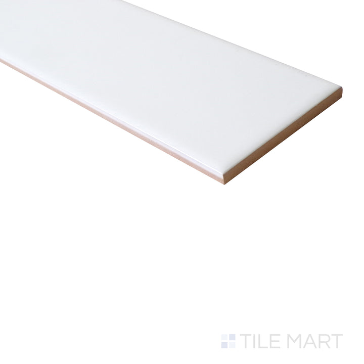 An angled perspective captures the elongated 3x12 glossy white tile, enhancing its sleek appearance and high-shine finish.