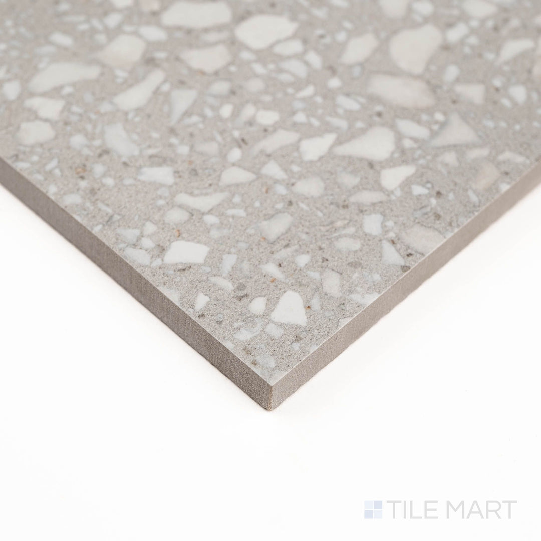 Corner detail highlights the subtle grey tones of Santorini Gris in a semi-gloss finish.