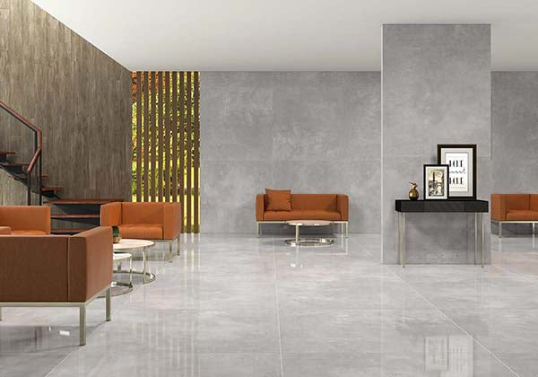 A refined and modern interior complemented by Kadence Gris polished porcelain, merging soft tones with an upscale sheen.