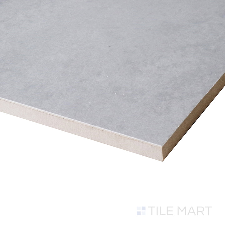 An angled close-up enhances the rich gray hues and glass-like shine of this Gris polished porcelain tile.