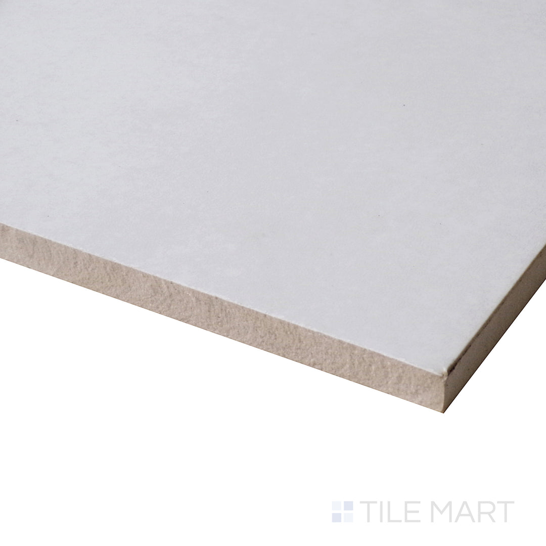 Angled perspective showcasing the luminous veining and high-gloss surface of Marmolab Calacatta 12X24 porcelain tile.