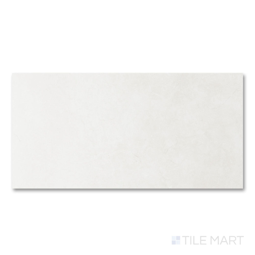 Full-piece detail of Lugano Marfil 24x48 polished porcelain tile highlighting warm stone character and luminous finish