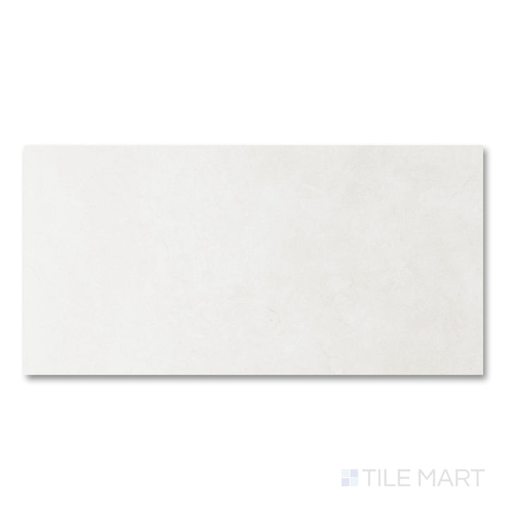 Full-piece detail of Lugano Marfil 24x48 polished porcelain tile highlighting warm stone character and luminous finish