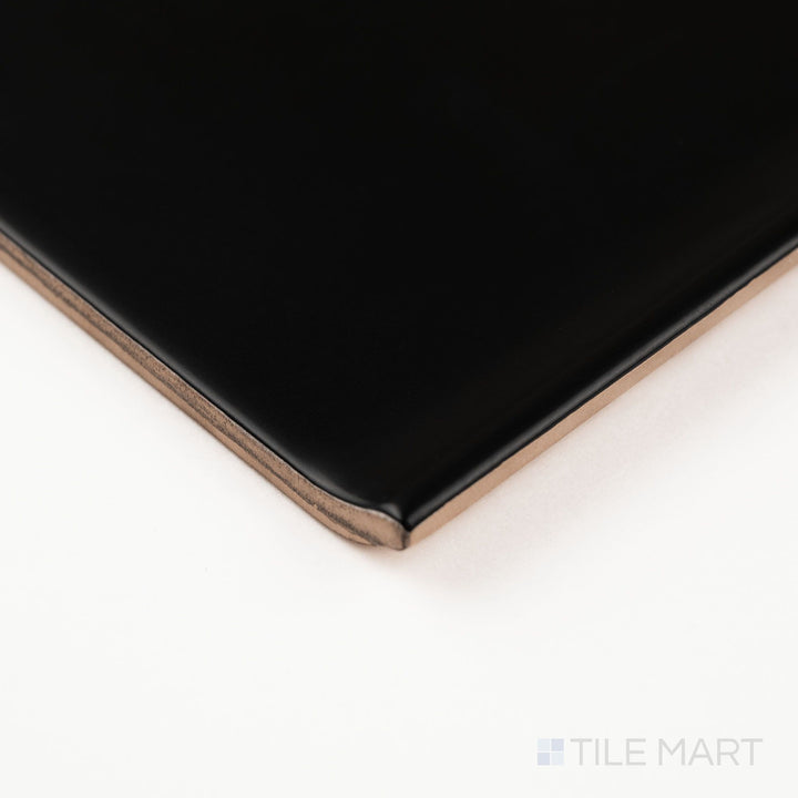 Black sanitary cove base 6x6 matte ceramic tile shown in corner view highlighting rounded base edge