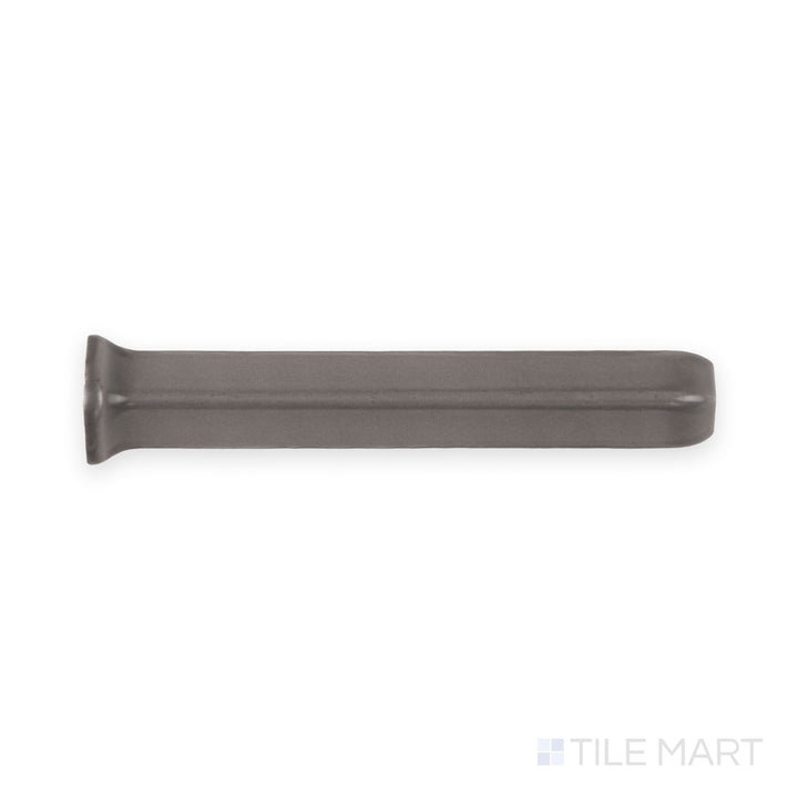 Top-down view of dark gray sanitary cove base 1x6 outside corner matte ceramic trim with curved edge profile