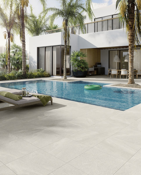 The grip finish gives Landscape Pavers New England White a textured quality across its surface.