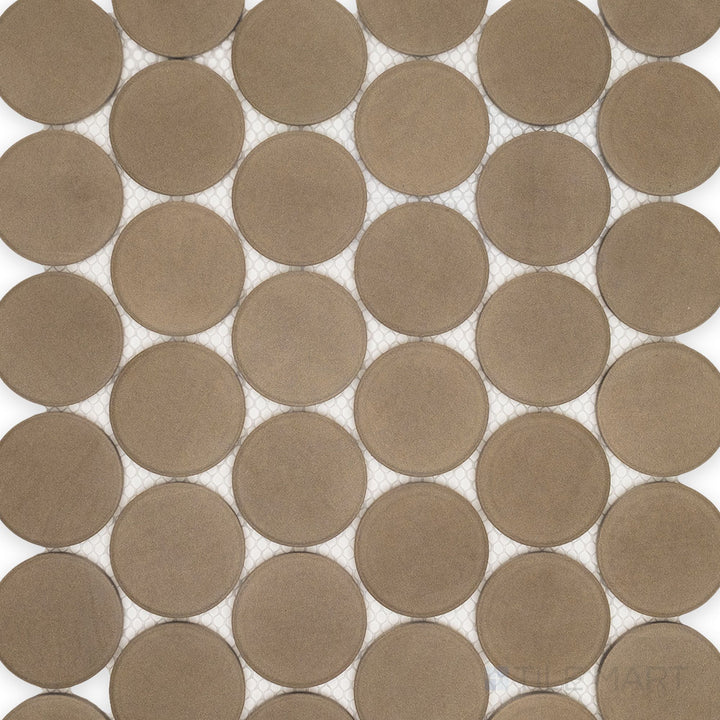 Capturing the sleek circular design and muted gray tones, this overview of the Amuri Grigio 2-Inch Round Matte Porcelain Mosaic Tile showcases its clean pattern and soft matte texture.