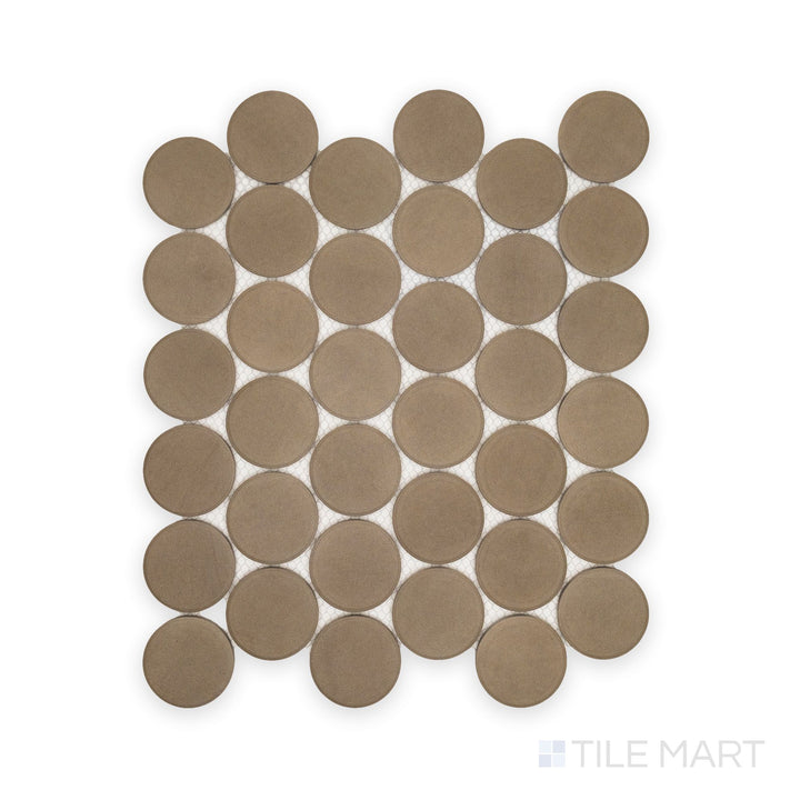 Flat lay of Amuri Grigio 2" Round Matte Porcelain Mosaic Tile featuring soft gray circular chips and a smooth matte surface arranged in a uniform pattern.