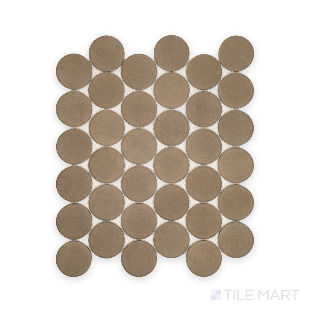 Flat lay of Amuri Grigio 2" Round Matte Porcelain Mosaic Tile featuring soft gray circular chips and a smooth matte surface arranged in a uniform pattern.