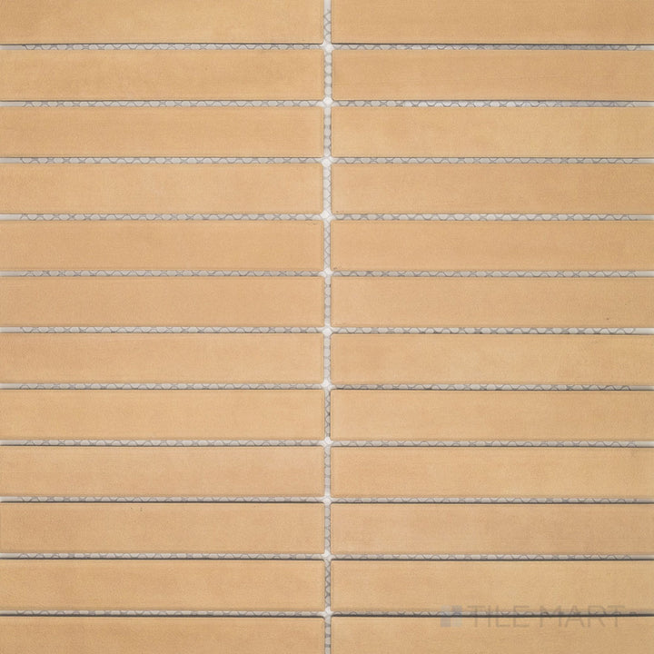 Characterized by its warm biscuit hue and matte finish, the Amuri Biscotto 1x6 Grid Matte Porcelain Mosaic Tile is displayed in an overview emphasizing its classic linear design.