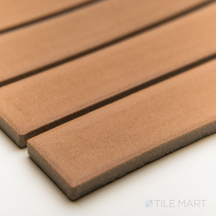 Corner-focused image of Amuri Cotto 1x6 grid mosaic tiles, highlighting rustic red hues and narrow matte porcelain format.