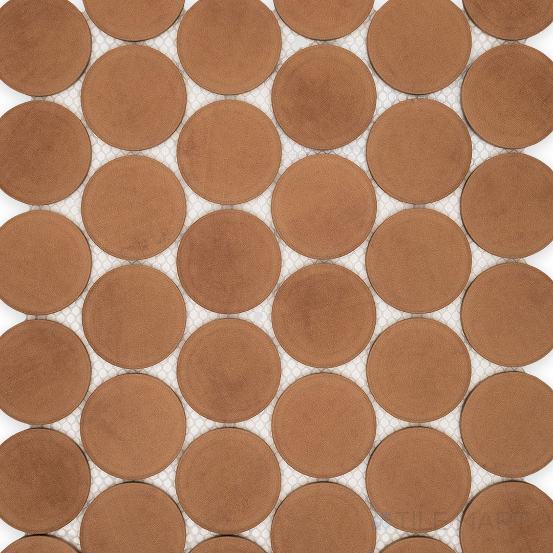 The overview of Amuri Cotto 2-Inch Round Matte Porcelain Mosaic Tile brings out its terracotta-inspired color, subtle circular pattern, and soft matte porcelain surface.