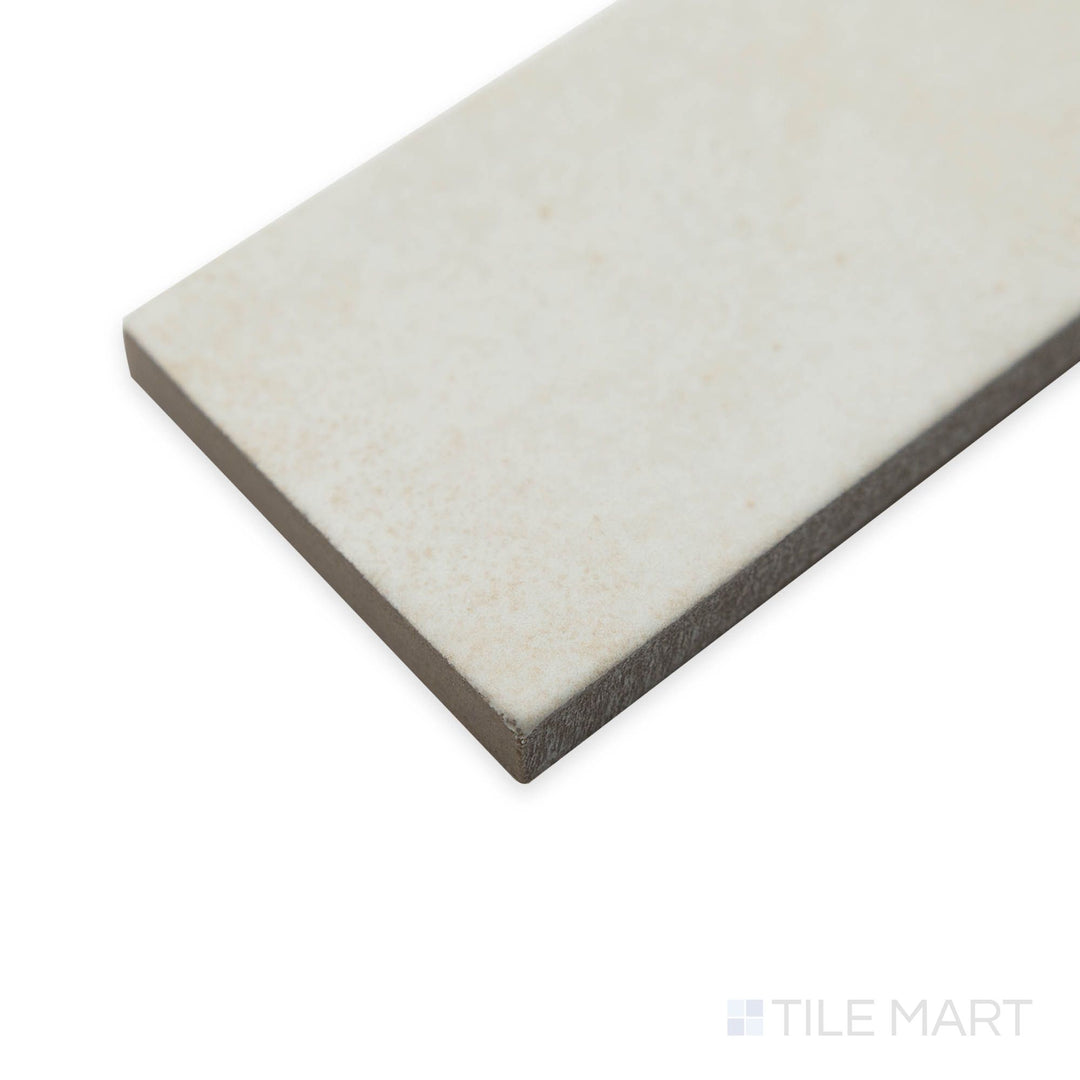 Corner shot of Amuri Brick Avorio 2x12 matte tiles revealing their smooth elongated shape in a creamy ivory tone.