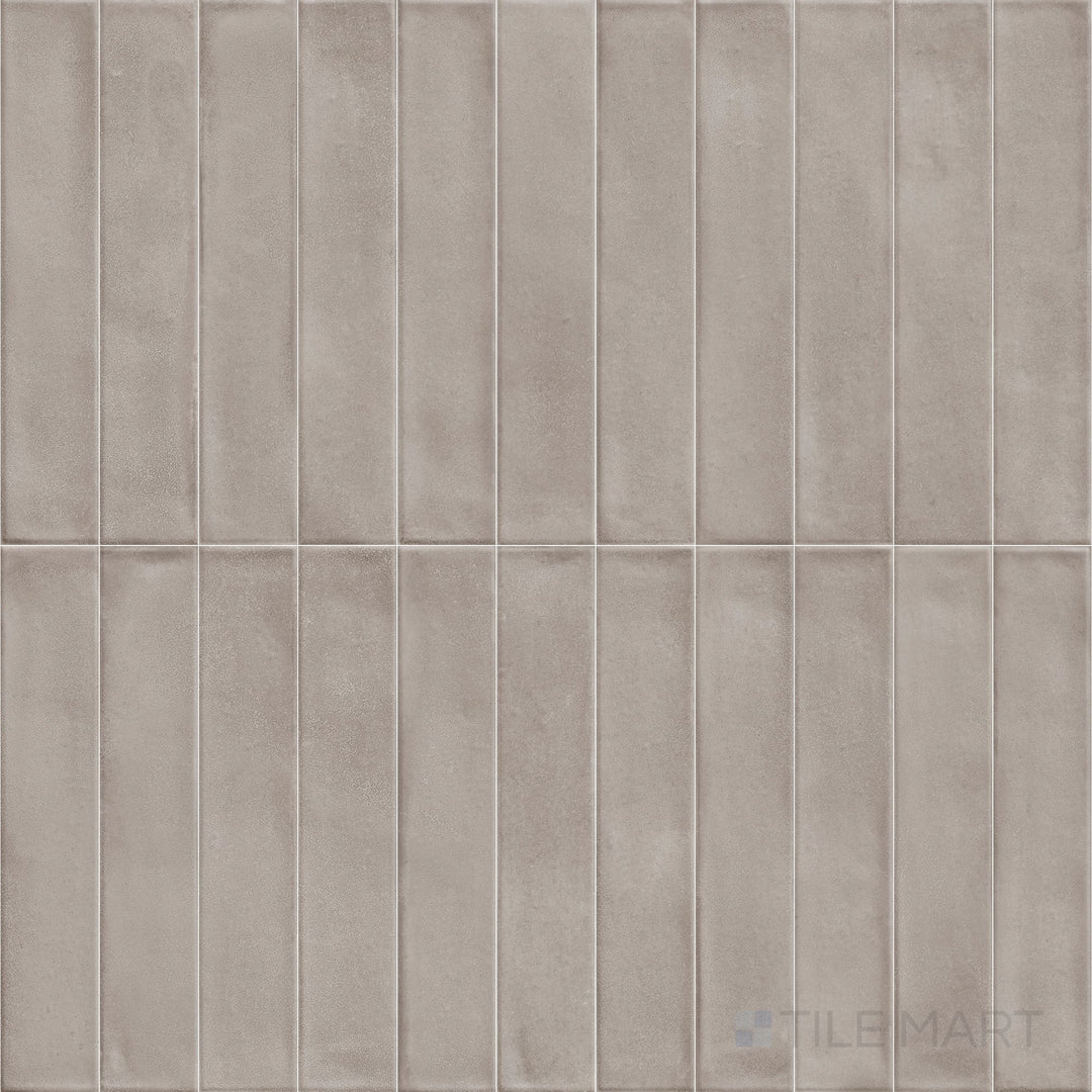 The Amuri Brick Grigio 2x12 Matte Porcelain Tile is presented in an overview capturing its elongated format, contemporary gray tone, and versatile matte finish suitable for walls or accents.