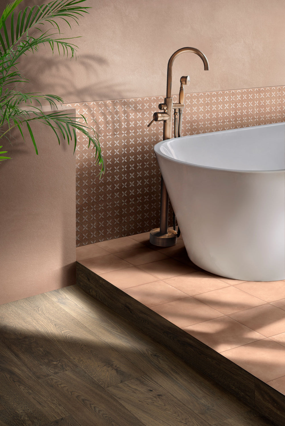 Modern bathroom with a freestanding bathtub, tiled wall, and plant, grounded by Amuri Cotto 8x8 Matte Porcelain Tile for a warm, Mediterranean-inspired design.