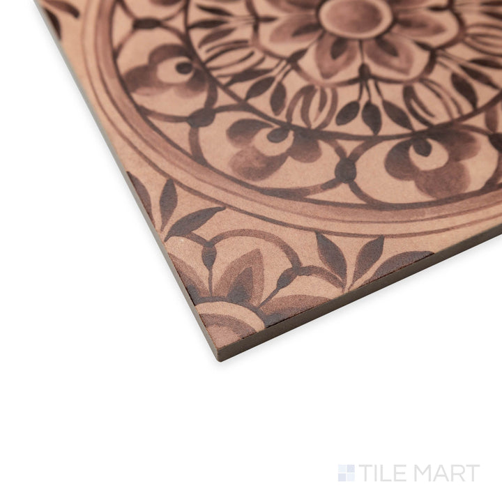 Corner shot of Amuri Decoro Pizzo Cotto with earthy red tones and embossed vintage-inspired detailing.