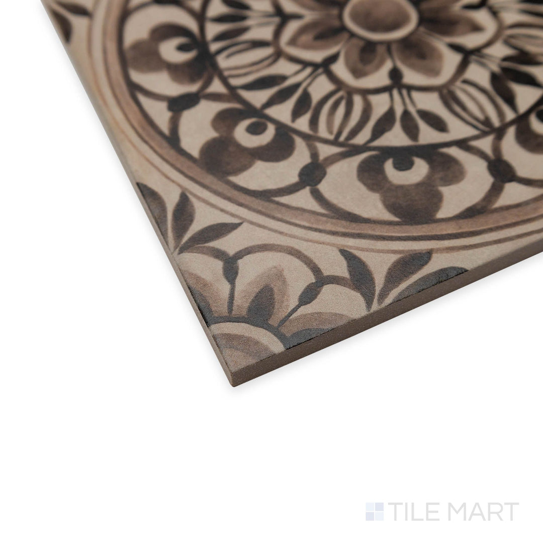 Angled perspective of Amuri Decoro Pizzo Grigio tile capturing the contrast between soft gray background and raised patterns.