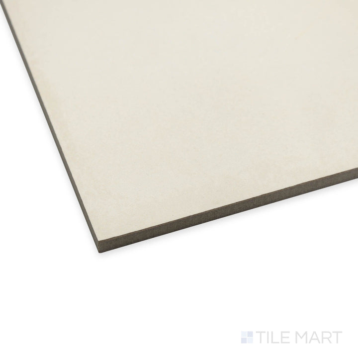 Corner angle of Amuri Avorio 24x24 porcelain tile highlighting its creamy ivory tone and smooth matte finish.