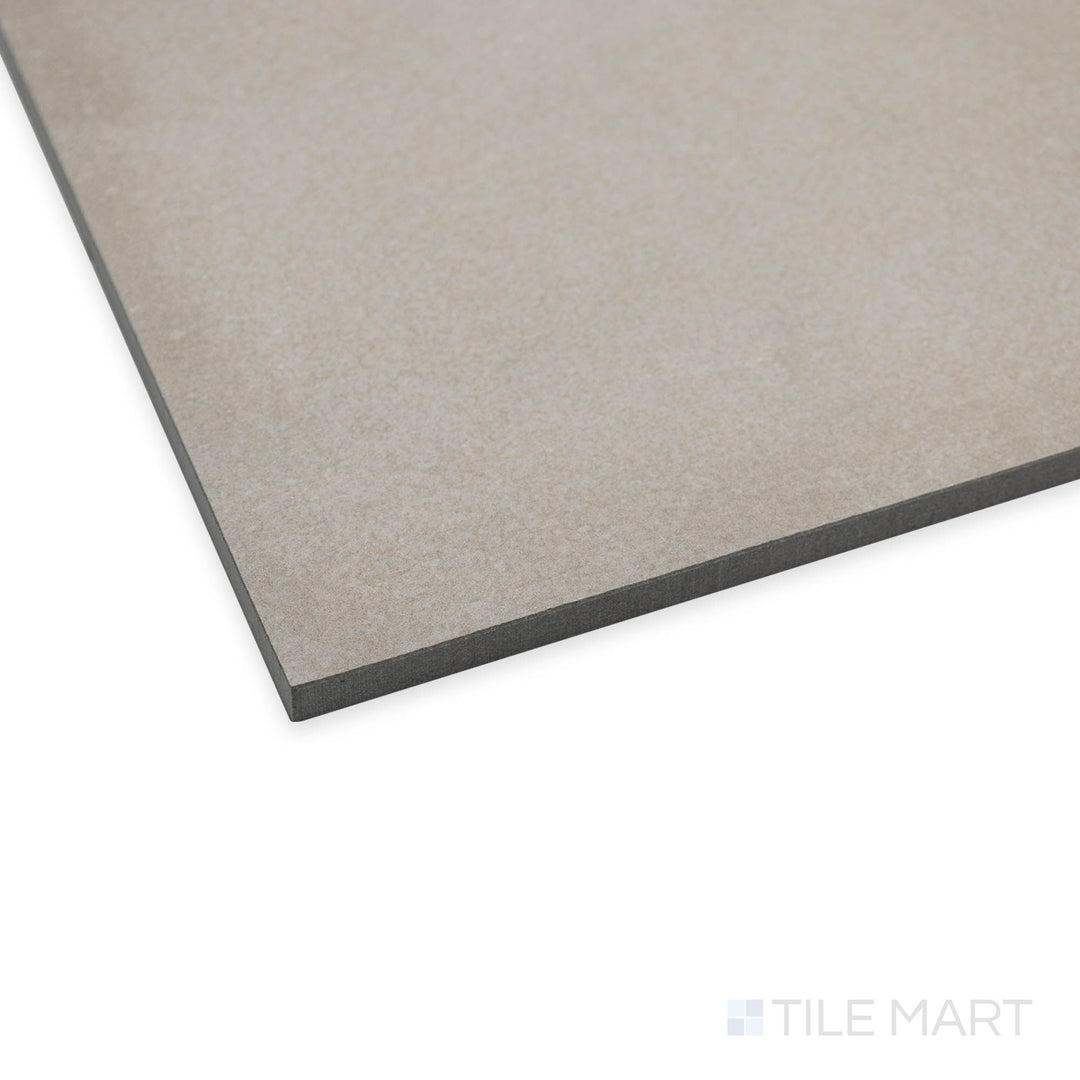 Angled corner image of Amuri Grigio 24x24 tile capturing its contemporary gray tones and soft finish.
