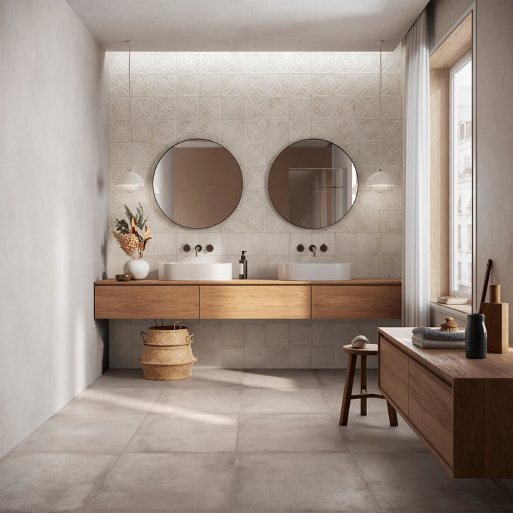 Modern bathroom with wooden vanity, round mirrors, and natural light, refined by Amuri Grigio 24x24 Matte Porcelain Tile for a sleek and calming finish.