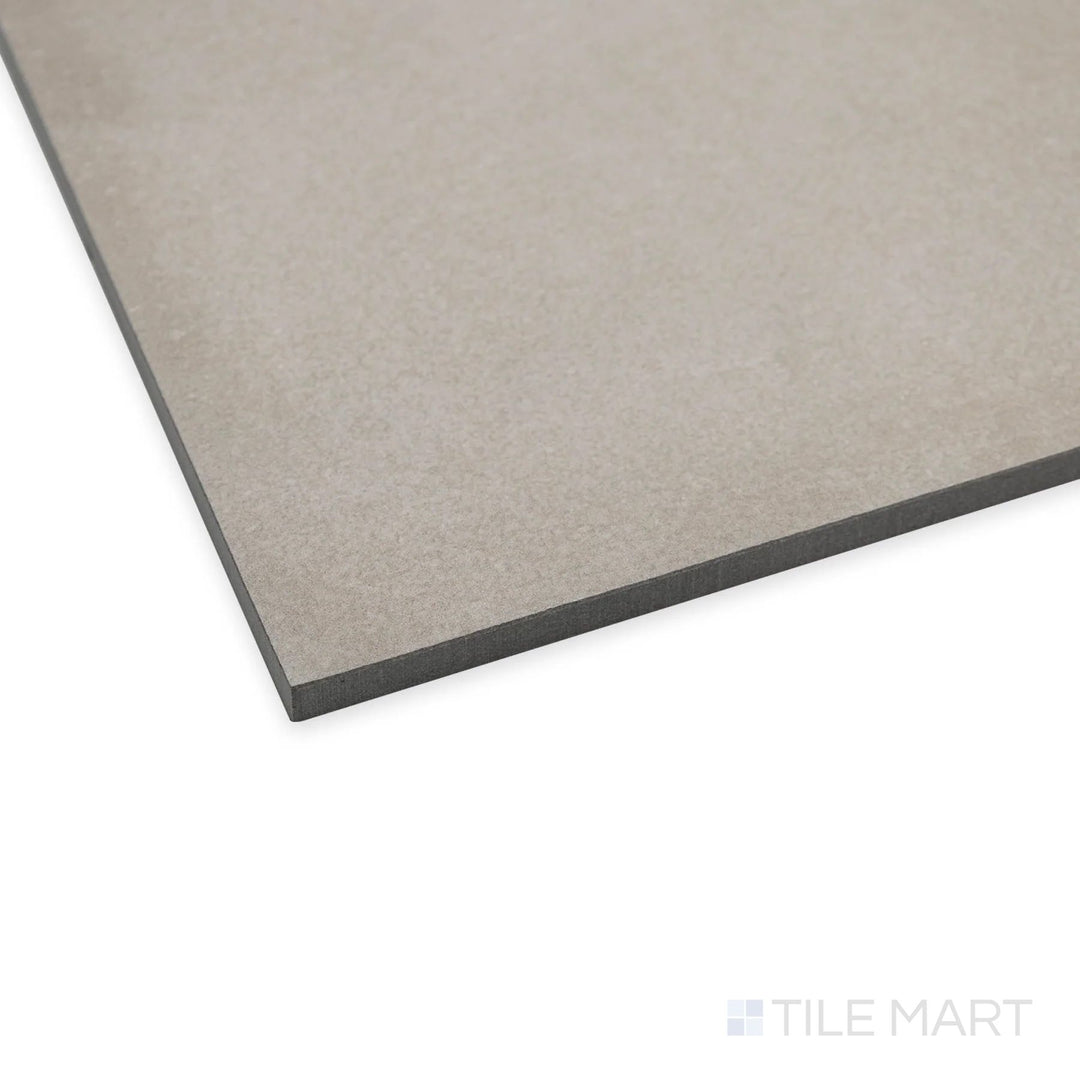 Angled view of Amuri Grigio 24x48 tile with a sleek gray appearance and balanced matte finish.