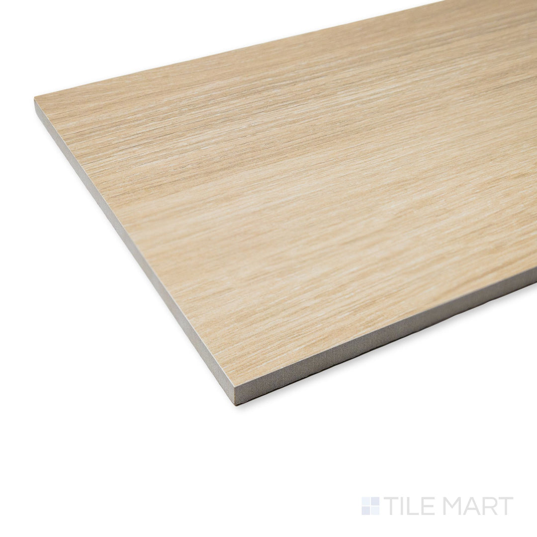 Corner view of Caila Rectified Oak 8x48 tile showcasing wood-inspired grain in a soft oak tone with modern matte finish.