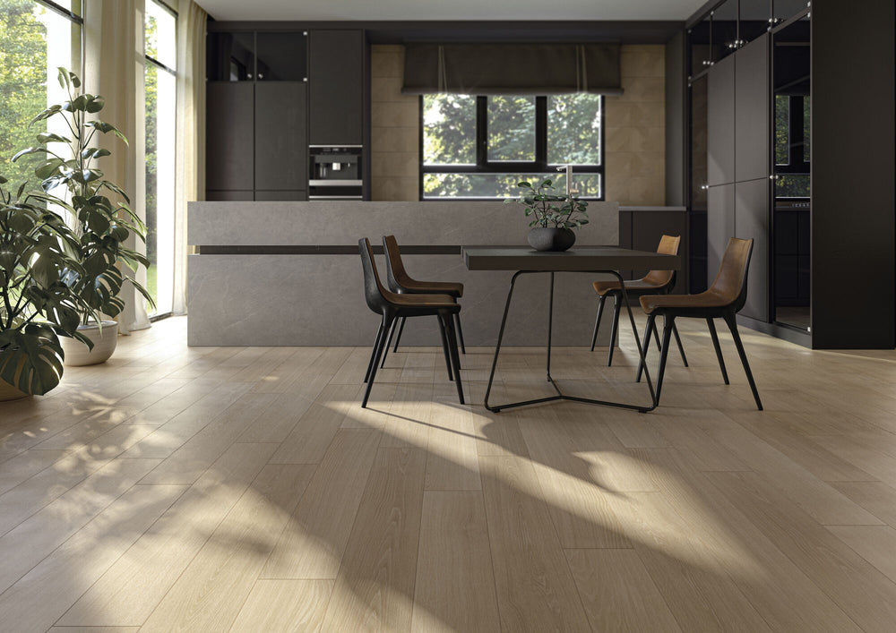 Modern kitchen with a dining area featuring a table and chairs, styled with Caila Rectified Oak 8x48 Matte Porcelain Tile for a natural wood-look finish.