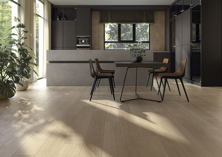 Modern kitchen with a dining area featuring a table and chairs, styled with Caila Rectified Oak 8x48 Matte Porcelain Tile for a natural wood-look finish.