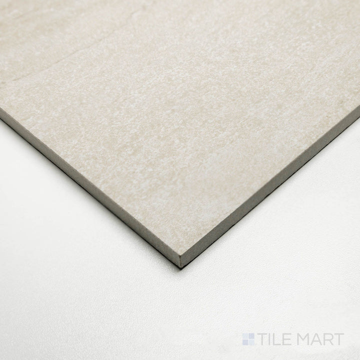 Perspective view of Dorset Vein Cut Beige 24x48 tile displaying soft sandy tones with horizontal veining.